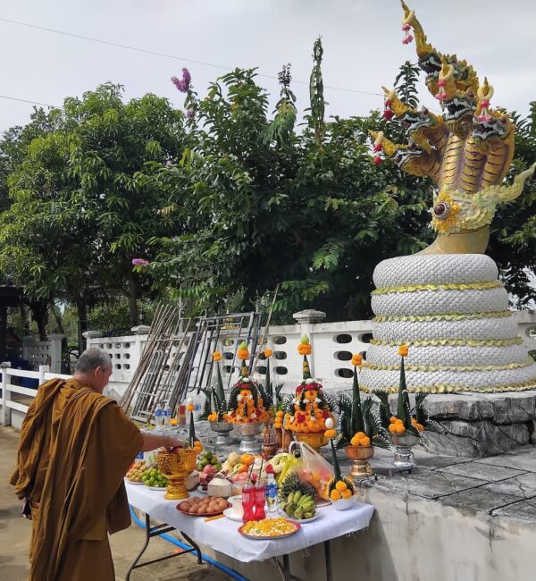 Monk blessing naga dragon at Kieng Kiri restaurant